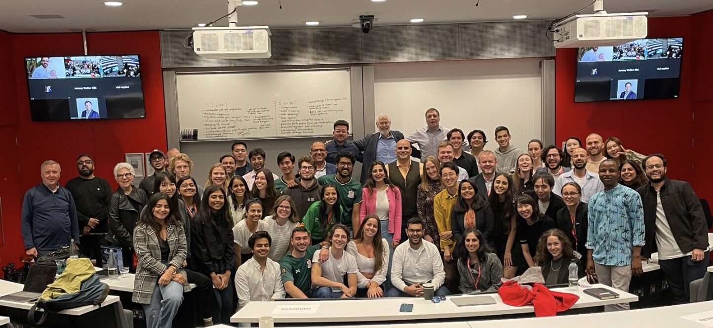 The 2025 Wicked Module cohort posing in an Imperial Business School classroom
